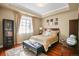 Well-lit bedroom featuring a bed, soft lighting, and a serene ambiance at 26 Royal Ann Dr, Greenwood Village, CO 80111