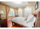 Bright bedroom with wood floors, comfortable bed, and ample natural light at 26 Royal Ann Dr, Greenwood Village, CO 80111