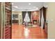 Open-concept living room featuring a fireplace, hardwood floors, and natural light at 26 Royal Ann Dr, Greenwood Village, CO 80111