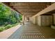 Covered patio with a view of the landscaped backyard, perfect for outdoor living at 26 Royal Ann Dr, Greenwood Village, CO 80111