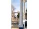 Picturesque view of lake through the porch columns and a black iron fence at 2515 Zenobia St, Denver, CO 80212