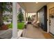 Relaxing front porch with white columns and comfortable seating, perfect for enjoying the neighborhood views at 2515 Zenobia St, Denver, CO 80212