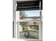 Window view showing a tranquil lake and the surrounding neighborhood at 2515 Zenobia St, Denver, CO 80212