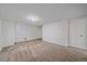 Large carpeted basement room with neutral walls and a window at 3730 Miller Ct, Wheat Ridge, CO 80033