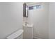 Small basement bathroom with a toilet and vanity at 3730 Miller Ct, Wheat Ridge, CO 80033