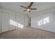 Spacious bedroom with double closets and a ceiling fan at 3730 Miller Ct, Wheat Ridge, CO 80033