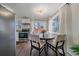 Cozy dining area with a table for four adjacent to the kitchen at 3730 Miller Ct, Wheat Ridge, CO 80033