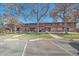 Row of brick townhouses with parking lot at 3730 Miller Ct, Wheat Ridge, CO 80033