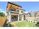 Modern home with backyard featuring a manicured lawn and covered patio at 300 S Franklin St, Denver, CO 80209