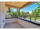 Open-air balcony with wood ceilings and views of the neighborhood at 300 S Franklin St, Denver, CO 80209