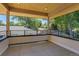 Covered balcony with railing and wood ceiling overlooking the landscape at 300 S Franklin St, Denver, CO 80209