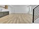 Finished basement with gray cabinets, bar area, light-colored flooring and walkout access at 300 S Franklin St, Denver, CO 80209