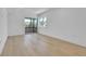 Bright bedroom with hardwood floors and sliding glass door to balcony at 300 S Franklin St, Denver, CO 80209