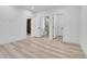 Spacious bedroom with multiple entry points, featuring light wood floors and neutral wall color at 300 S Franklin St, Denver, CO 80209