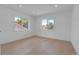 Bright, spacious bedroom with large windows offering lovely outdoor views and light hardwood floors at 300 S Franklin St, Denver, CO 80209