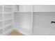 Large walk-in closet featuring custom shelving and hanging rods for optimal organization and storage at 300 S Franklin St, Denver, CO 80209