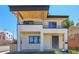 Modern two-story home with stone facade, black trim, wood soffits and dual balconies at 300 S Franklin St, Denver, CO 80209