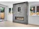 Living room fireplace with gray marble accent wall, providing a modern and cozy touch to the room at 300 S Franklin St, Denver, CO 80209