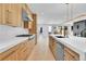 Open kitchen with white countertops, light wood cabinets, and stainless steel appliances at 300 S Franklin St, Denver, CO 80209