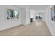 Bright and airy living room with large windows and hardwood floors at 300 S Franklin St, Denver, CO 80209