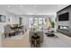 Bright and spacious living room featuring modern furnishings and a sleek fireplace with large sliding glass doors at 300 S Franklin St, Denver, CO 80209