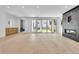 Bright and spacious living room features a modern fireplace and sliding glass doors to the yard at 300 S Franklin St, Denver, CO 80209