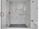 Modern bathroom with a glass shower and marble tiling at 300 S Franklin St, Denver, CO 80209