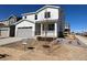 View of a charming two-story home featuring a covered porch, a gray garage door, and an available sign at 24799 E 39Th Ave, Aurora, CO 80019