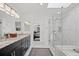 Bathroom features double vanity, a shower with glass door, and neutral finishes at 8453 S Scenic Dr, Morrison, CO 80465