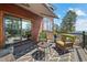 Outdoor deck with plush seating arrangements and scenic views, creating an ideal entertaining space at 8453 S Scenic Dr, Morrison, CO 80465