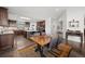 Open-concept dining area next to kitchen with stylish furnishings and hardwood floors at 8453 S Scenic Dr, Morrison, CO 80465