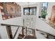 Inviting entryway features hardwood stairs, modern railing, and decorative lighting at 8453 S Scenic Dr, Morrison, CO 80465