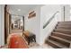 Hallway with a decorative bench, wooden coat rack, and staircase, blending style with functionality at 8453 S Scenic Dr, Morrison, CO 80465