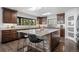 Modern kitchen with a large island, stainless steel appliances, and ample cabinet space at 8453 S Scenic Dr, Morrison, CO 80465