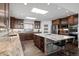 Stylish kitchen featuring a large center island with seating and modern appliances at 8453 S Scenic Dr, Morrison, CO 80465