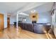 Basement with a large leather sofa, hardwood floors, a fireplace, and a pool table in the background at 6464 S Swadley Way, Littleton, CO 80127