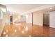 Large basement with hardwood floors, support pillars, and multiple closets at 6464 S Swadley Way, Littleton, CO 80127