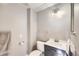 Neutral colored bathroom with modern vanity, towel rack, and toilet paper holder at 6464 S Swadley Way, Littleton, CO 80127