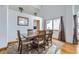 Inviting dining room with hardwood floors, vaulted ceilings, and plenty of natural light at 6464 S Swadley Way, Littleton, CO 80127