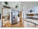 Bright, open-concept kitchen featuring stainless steel appliances and a spacious layout perfect for modern living at 6464 S Swadley Way, Littleton, CO 80127