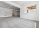 Large finished basement with recessed lighting and neutral carpet; interior door visible at 24788 E 40Th Ave, Aurora, CO 80019