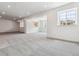 Large finished basement with recessed lighting and neutral carpet and bright windows throughout at 24788 E 40Th Ave, Aurora, CO 80019
