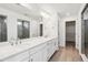 Modern bathroom boasts dual vanities, quartz countertop, walk-in shower, and ample storage space at 24788 E 40Th Ave, Aurora, CO 80019