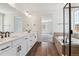 Stylish bathroom with double vanity, quartz countertops, and a separate tub and shower at 24788 E 40Th Ave, Aurora, CO 80019
