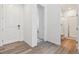 Modern bathroom with a glass-enclosed shower, white vanity and light wood-look flooring at 24788 E 40Th Ave, Aurora, CO 80019