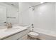 Bright bathroom features single sink with white countertops and a shower over tub with tiled wall at 24788 E 40Th Ave, Aurora, CO 80019