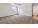Spacious bedroom featuring a neutral color palette, a window and a carpeted floor at 24788 E 40Th Ave, Aurora, CO 80019