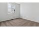 Bright bedroom with neutral carpeting and a large window providing ample natural light at 24788 E 40Th Ave, Aurora, CO 80019