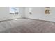 Spacious bedroom with neutral carpet and ample natural light from multiple windows at 24788 E 40Th Ave, Aurora, CO 80019