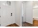 Bright entryway showcasing a white front door and beautiful hard wood floors at 24788 E 40Th Ave, Aurora, CO 80019